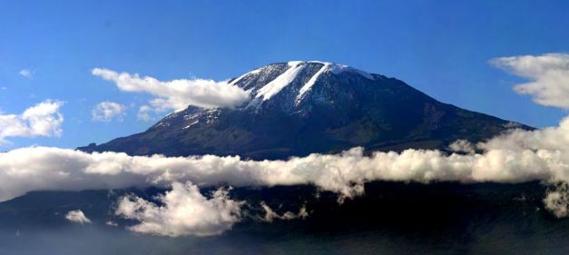 Rising up starkly above the plains, Mount Kilimanjaro is perhaps one of the worlds most recognised mountains